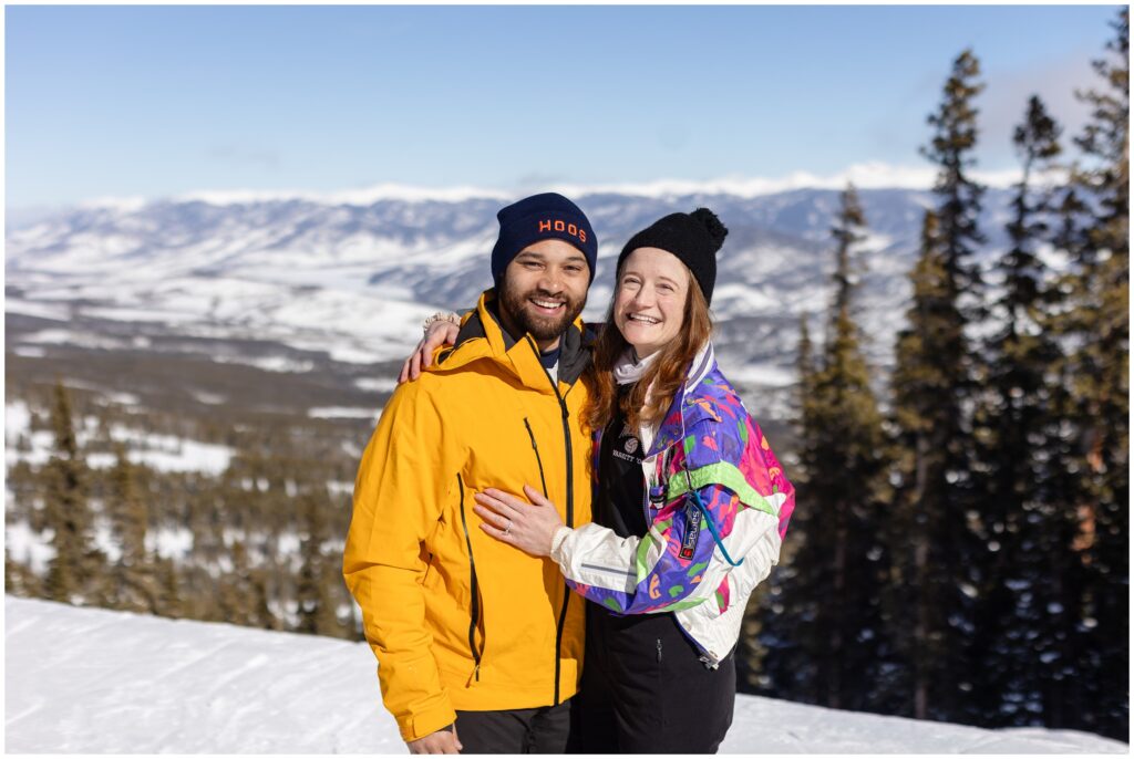 Couple embracing during Breckenridge mountain proposal