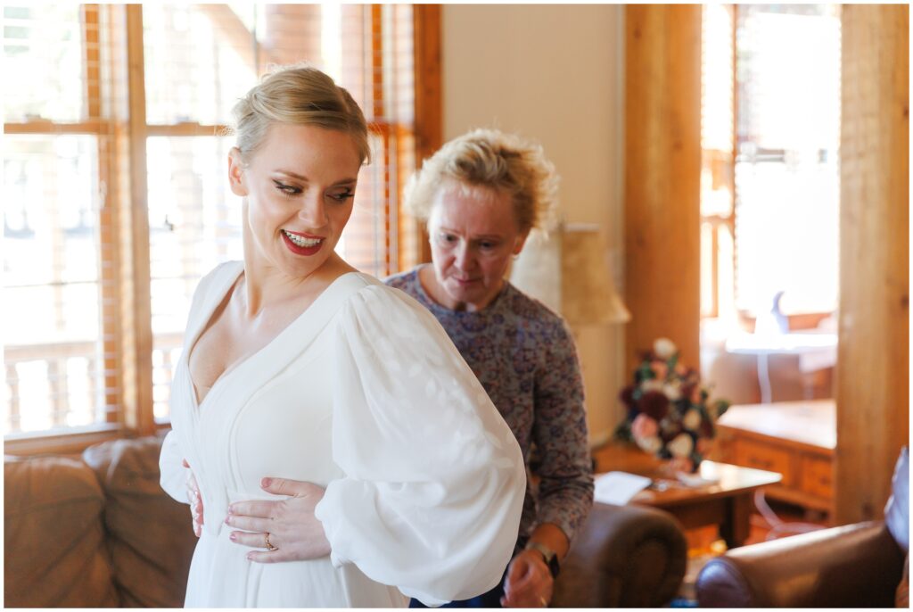 Bride getting dress on