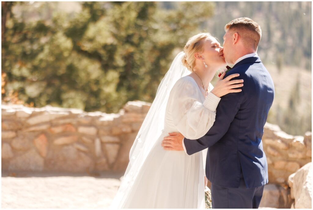 Bride and groom kissing during first look