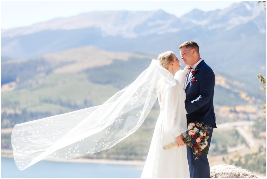 Brides veil blowing in wind during first look