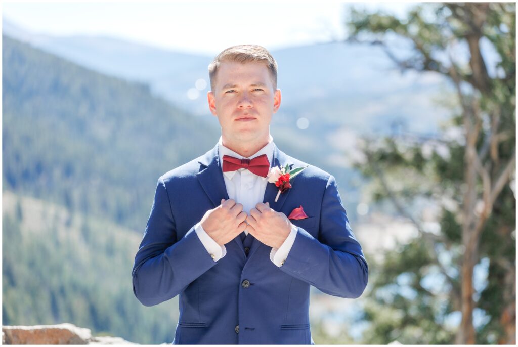 Groom standing on deck at The Lodge at Breckenridge