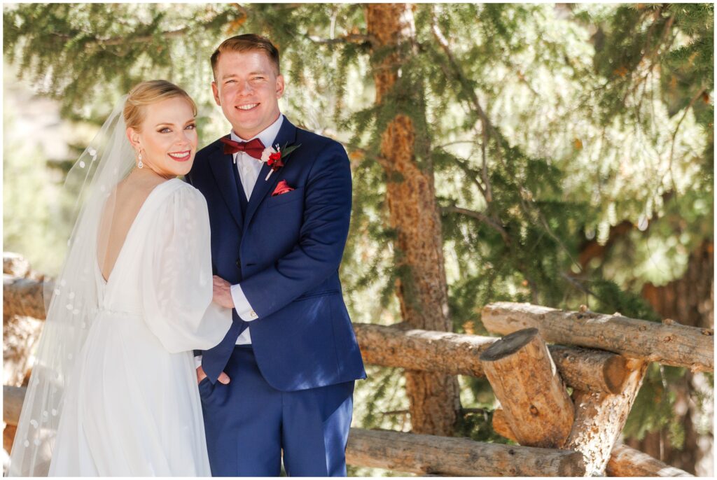 Bride and groom holding hands on trail 