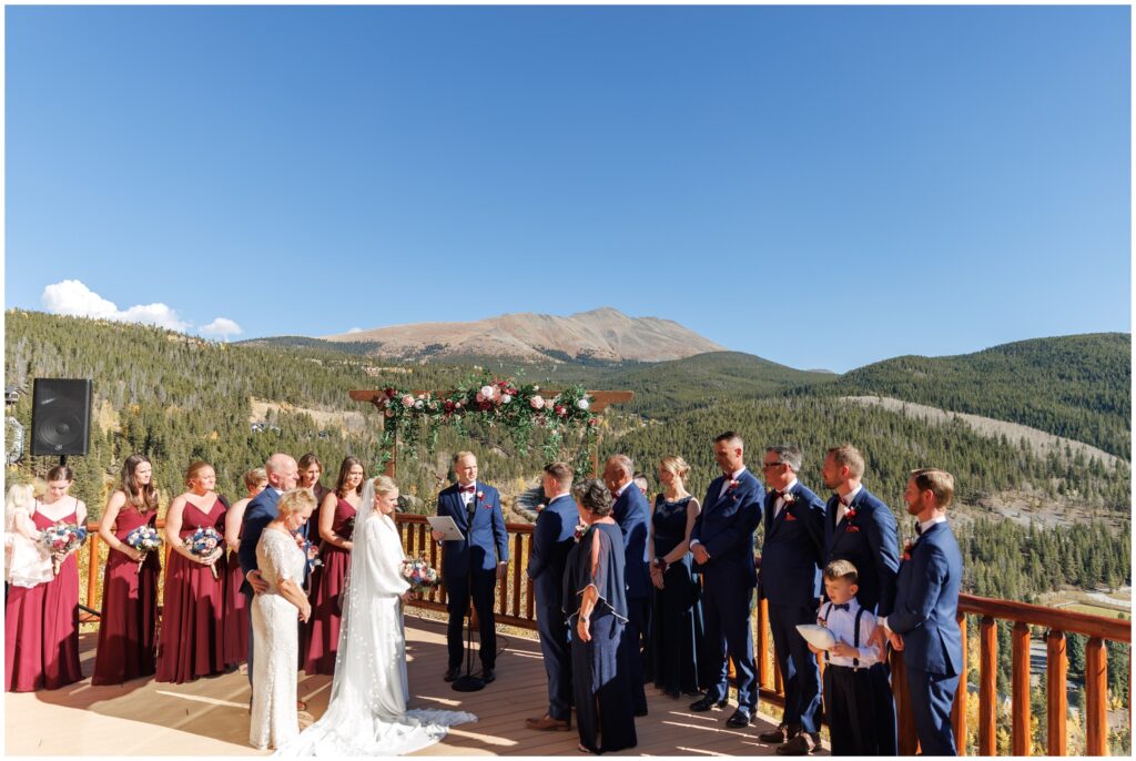 Bridal party on deck during ceremony The Lodge at Breckenridge