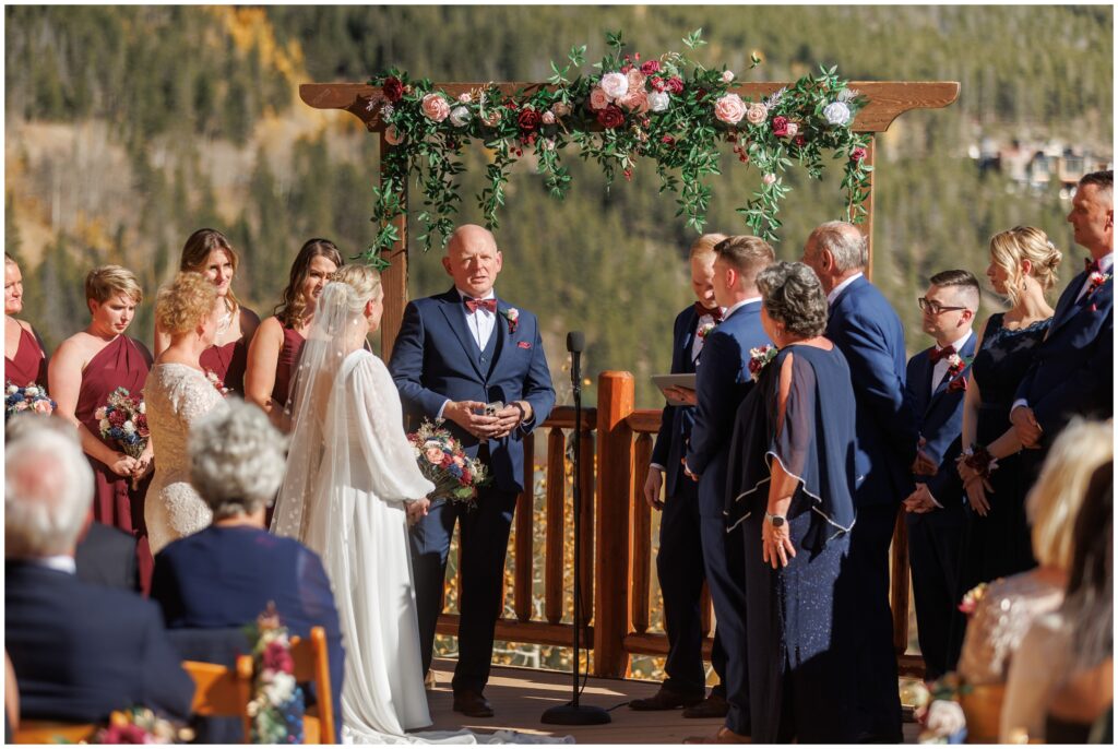 Officiant speaking to bride and groom