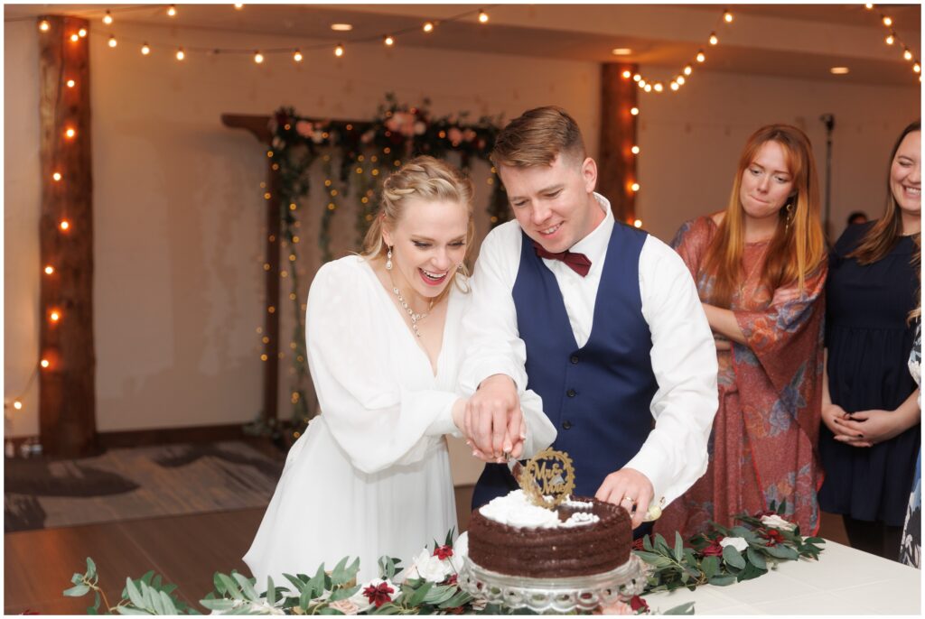 Bride and groom cutting cake