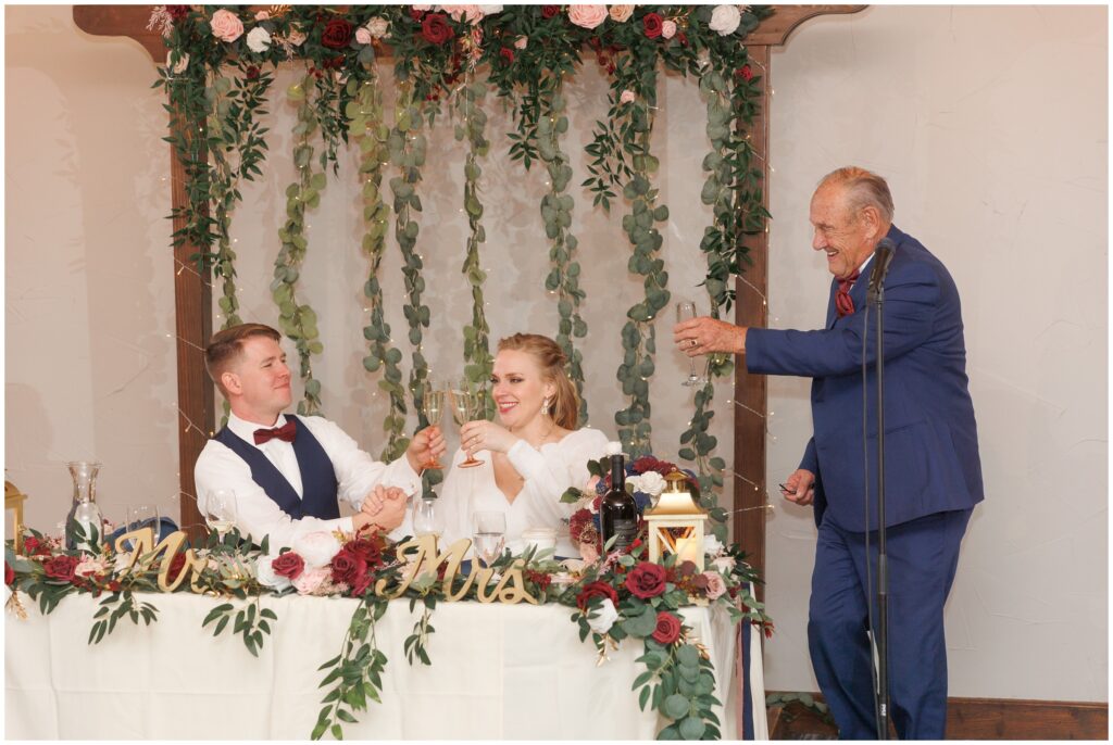 Bride and groom toasting during speech