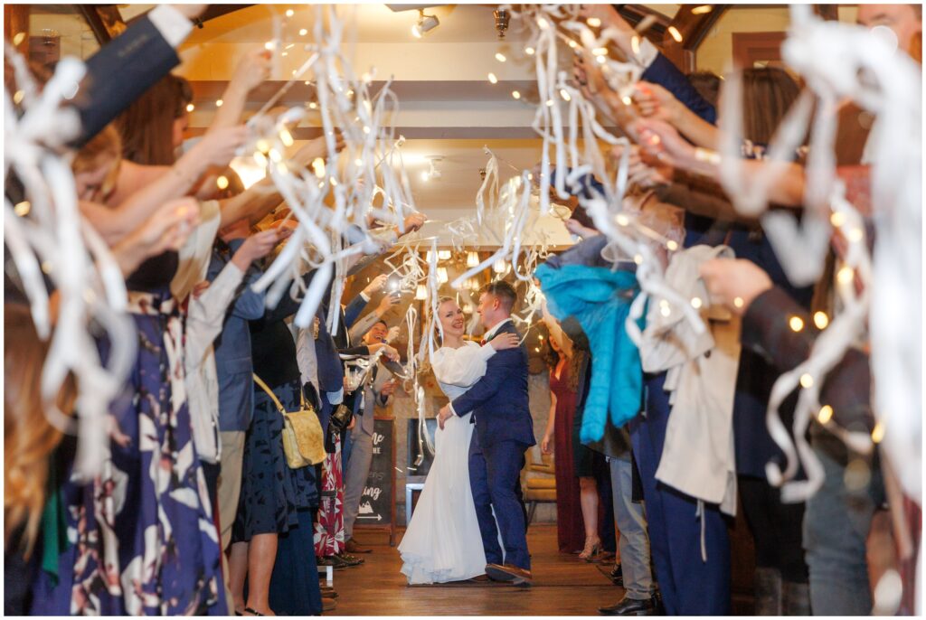 Bride and groom exiting at The Lodge at Breckenridge after reception