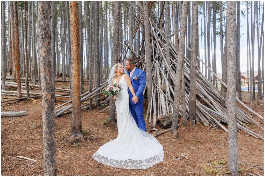 Bride and groom in a forest of pine trees