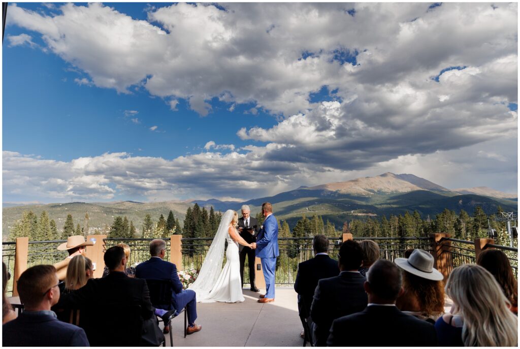 Guests viewing ceremony with Breckenridge mountains in background