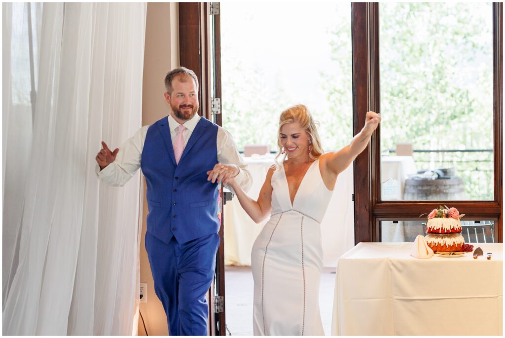 Bride and groom making grand entrance inside Sevens at Peak 7 in Breckenridge