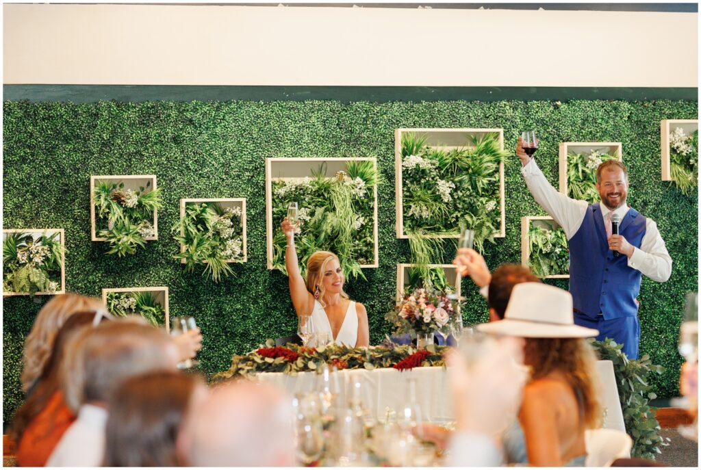 Bride and groom toasting with guests at Sevens at Peak 7 in Breckenridge