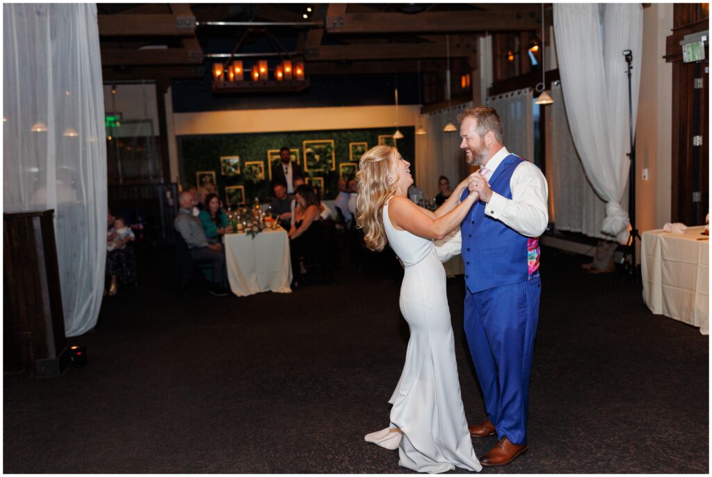 Bride and broom holding hands during first dance