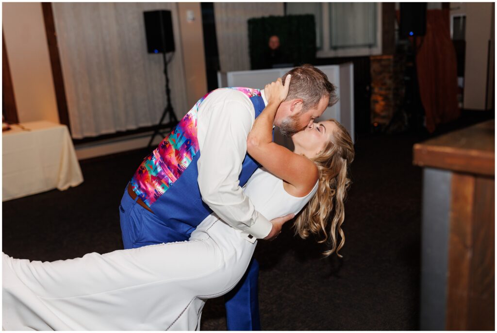 Groom dipping bride during first dance