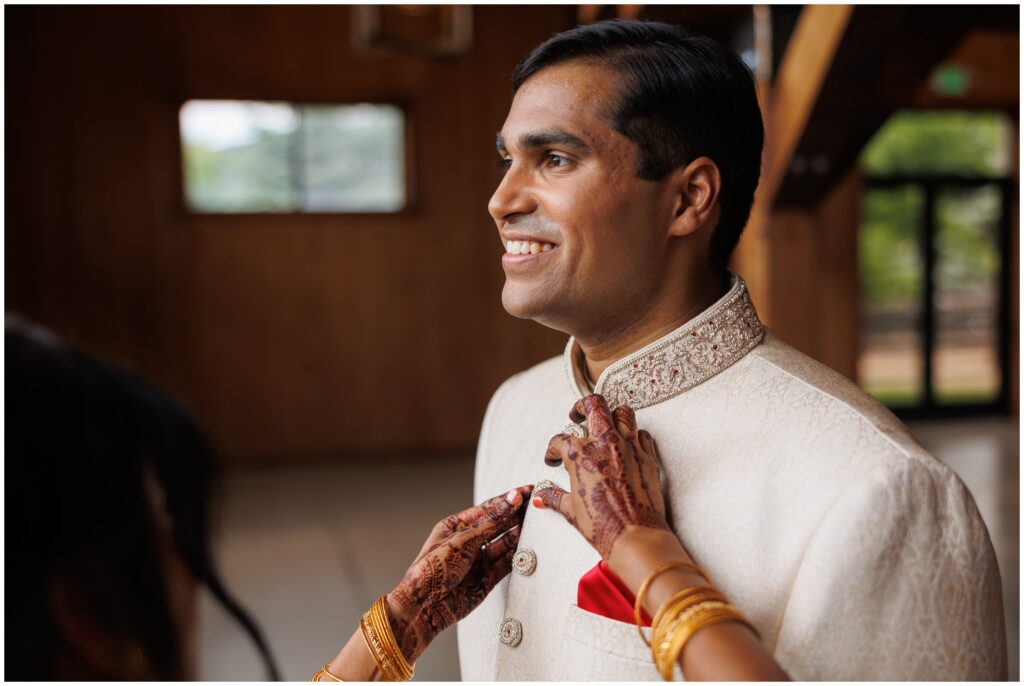 Groom getting ready for wedding at Spruce Mountain 