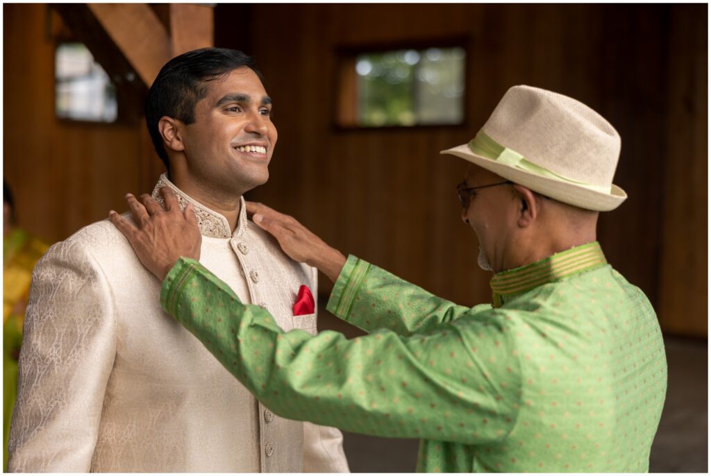 Father of groom helping get ready for wedding at Spruce Mountain 
