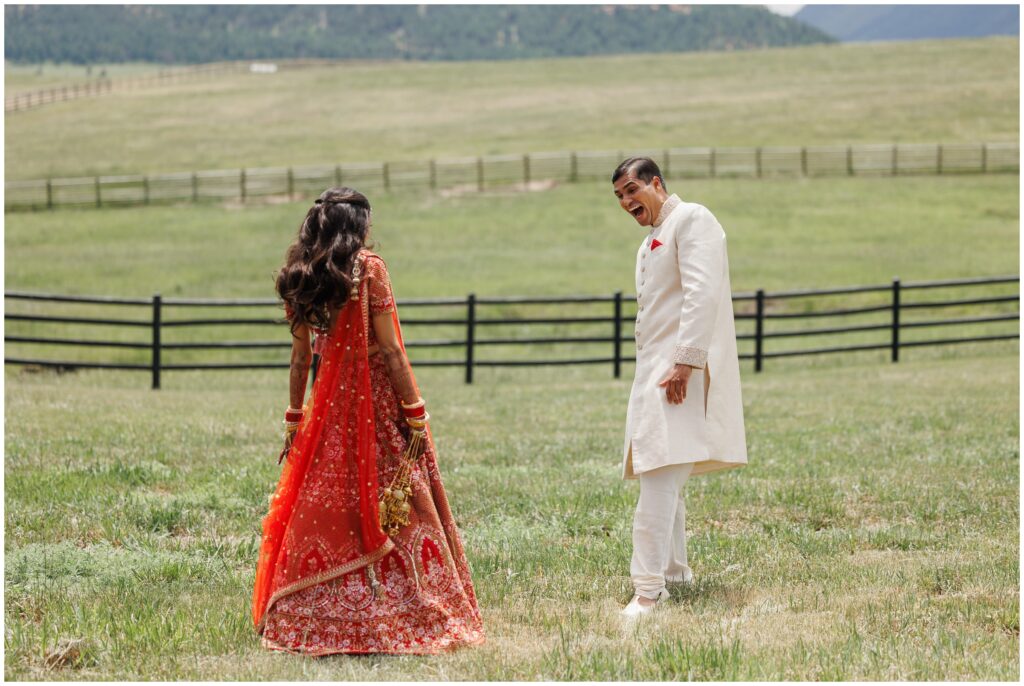 Groom seeing bride for first time during first look at Spruce Mountain 