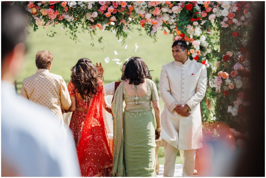 Groom seeing bride walk down during ceremony at Spruce Mountain 