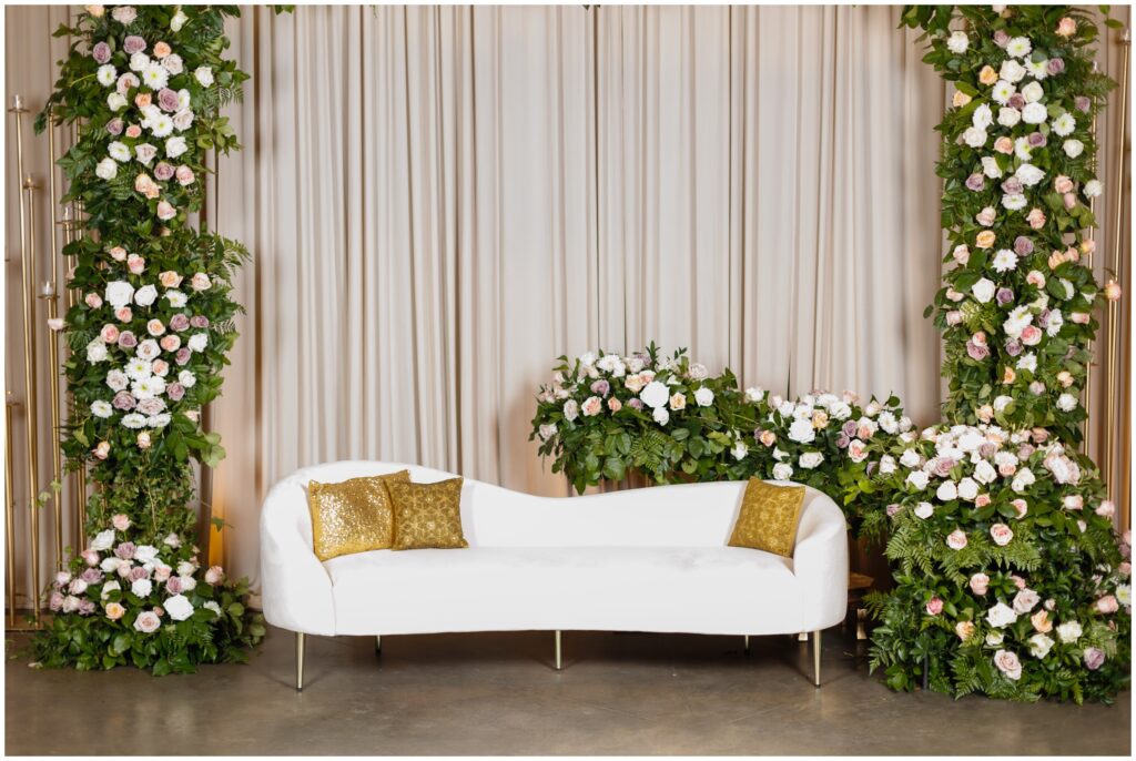 Floral decor around coach in reception room Reception room at Spruce Mountain