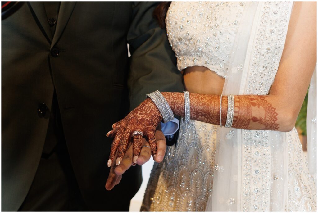 bride and groom holding hands