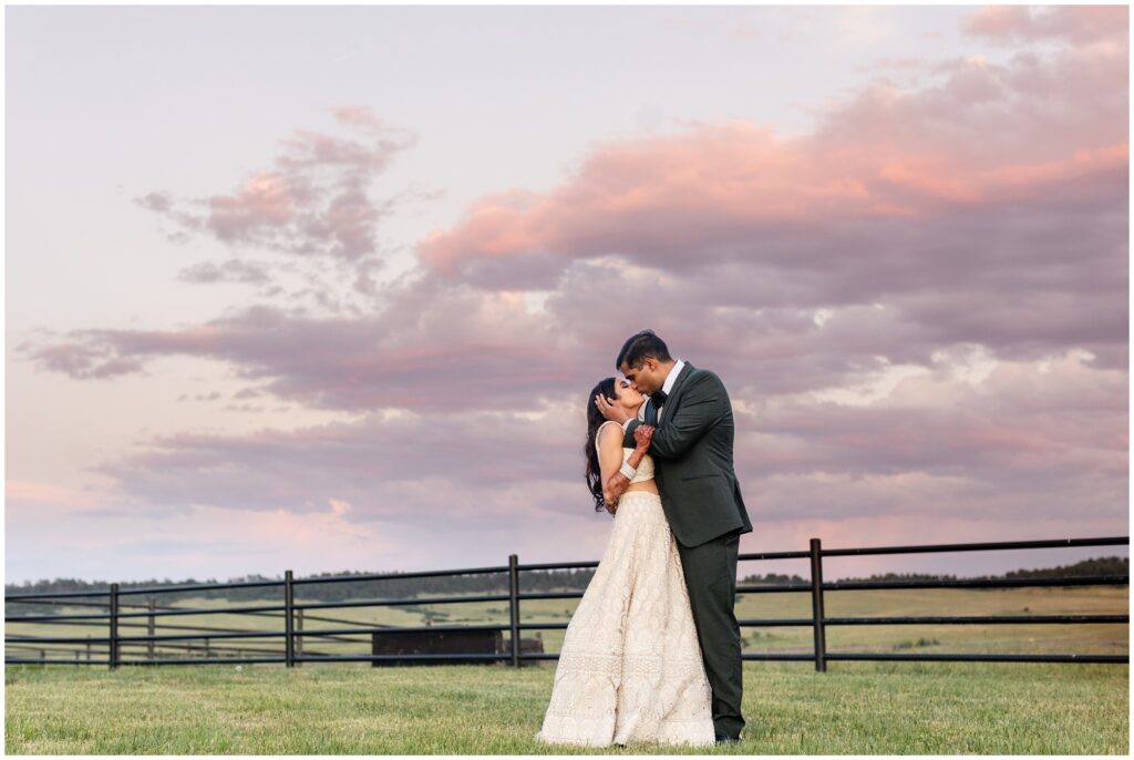 bride and groom at Spruce Mountain during sun down