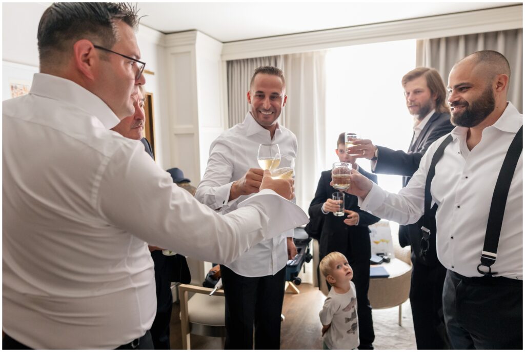 Groomsmen toasting during getting ready