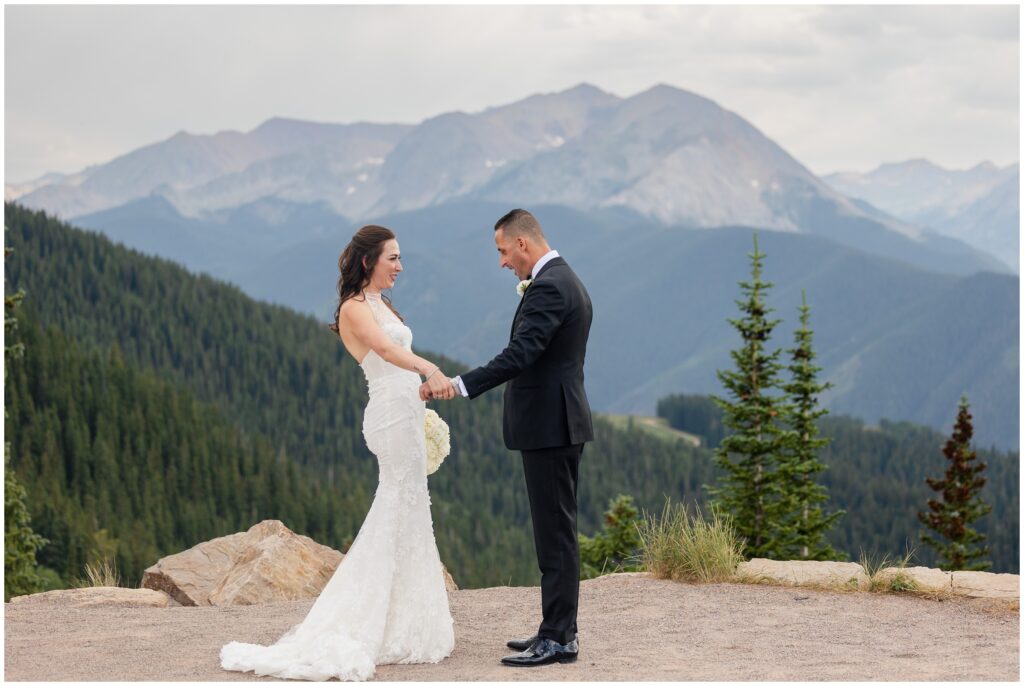 Bride and groom holding hands during first look