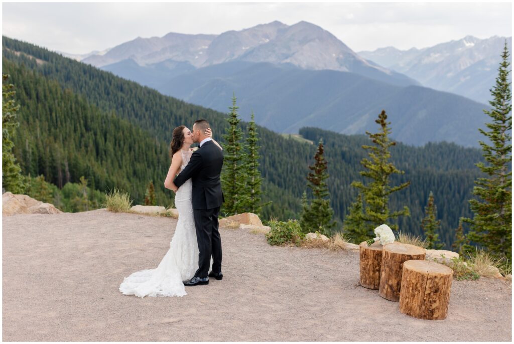 bride and groom kissing during first look