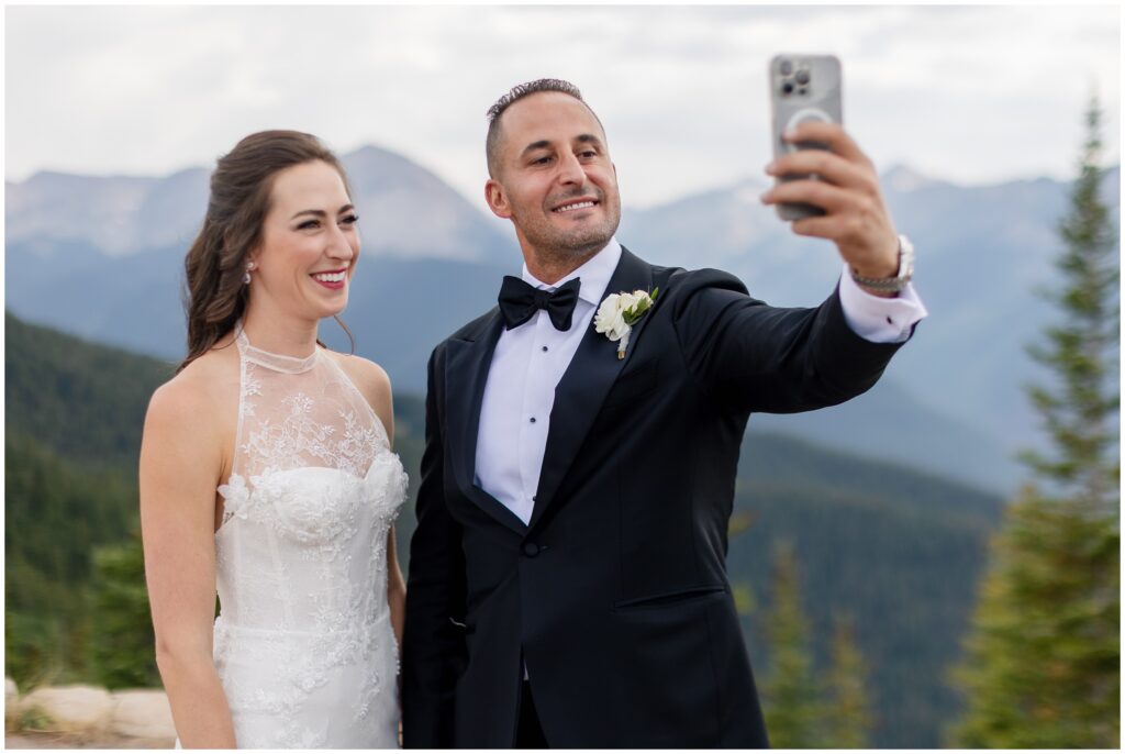 bride and groom taking selfie