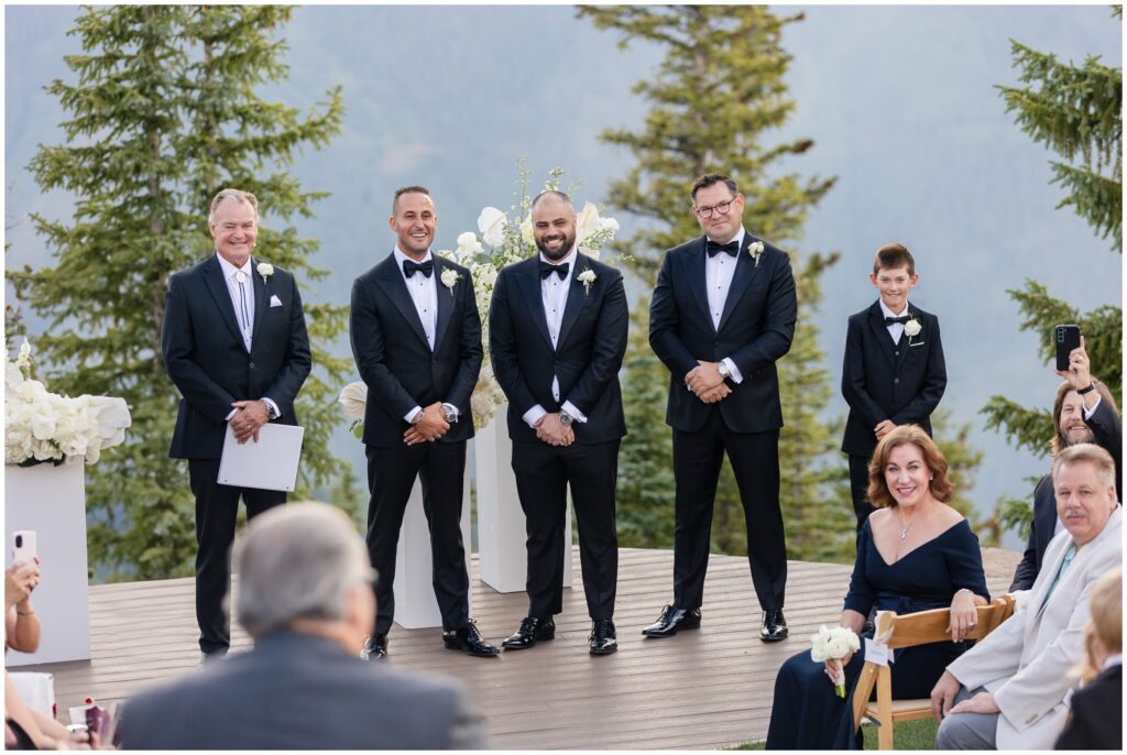 Groomsmen standing for wedding ceremony
