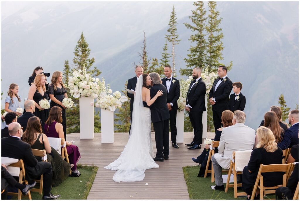 Bride hugging dad after being walked down