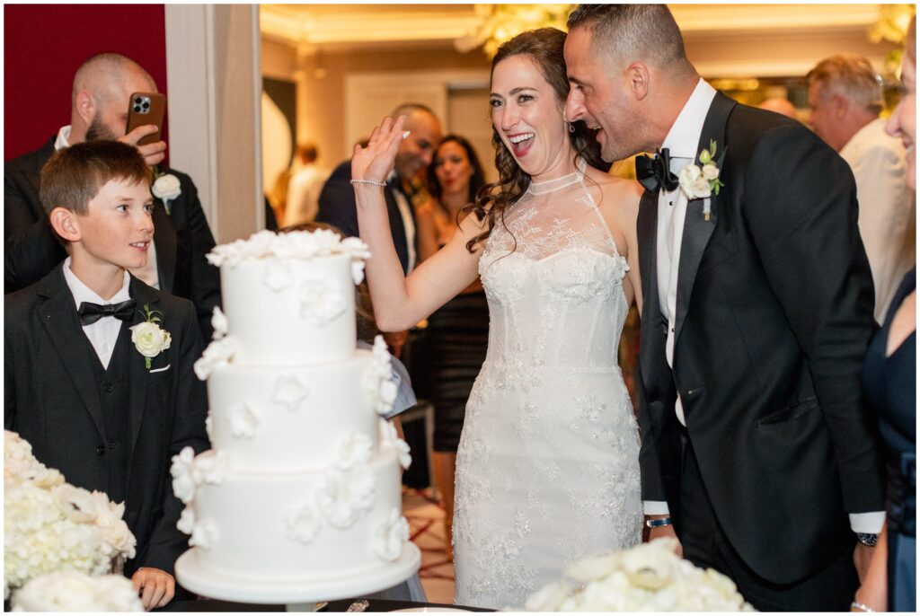 Bride and groom cutting cake Aspen Mountain Club