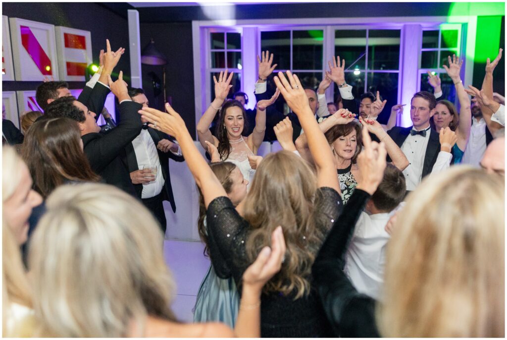 Bride dancing with guests at Aspen Mountain Club