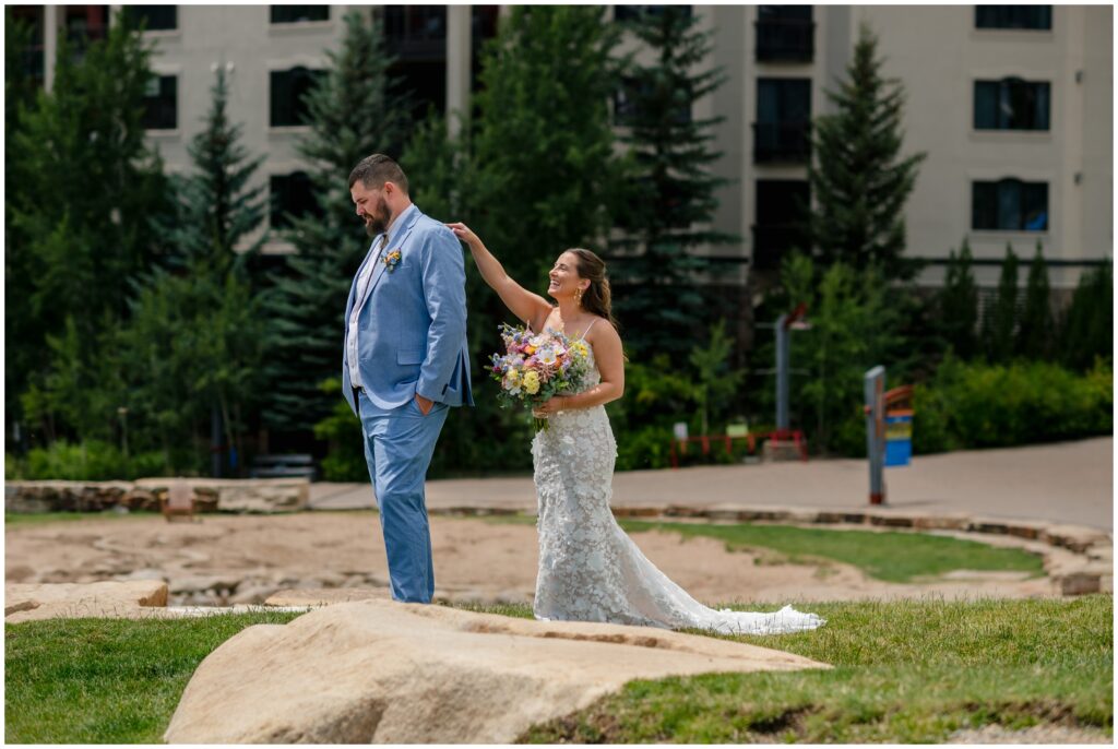 Bride tapping on groom's shoulder for first look