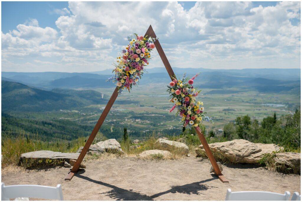Floral Arch designed by Petal and Bean on mountain at Steamboat Mountain