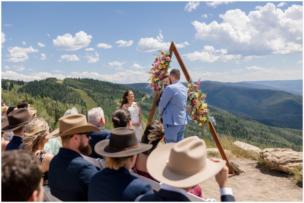 Bride and groom looking at each other during ceremony at Steamboat mountain