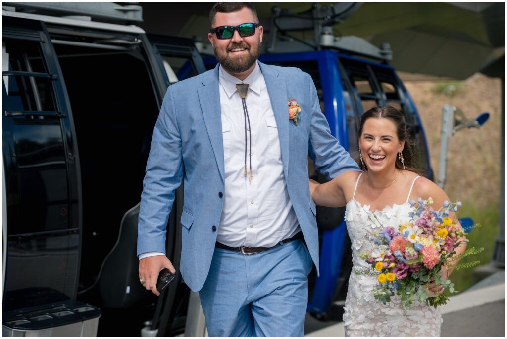Bride and groom walking off steamboat gondola