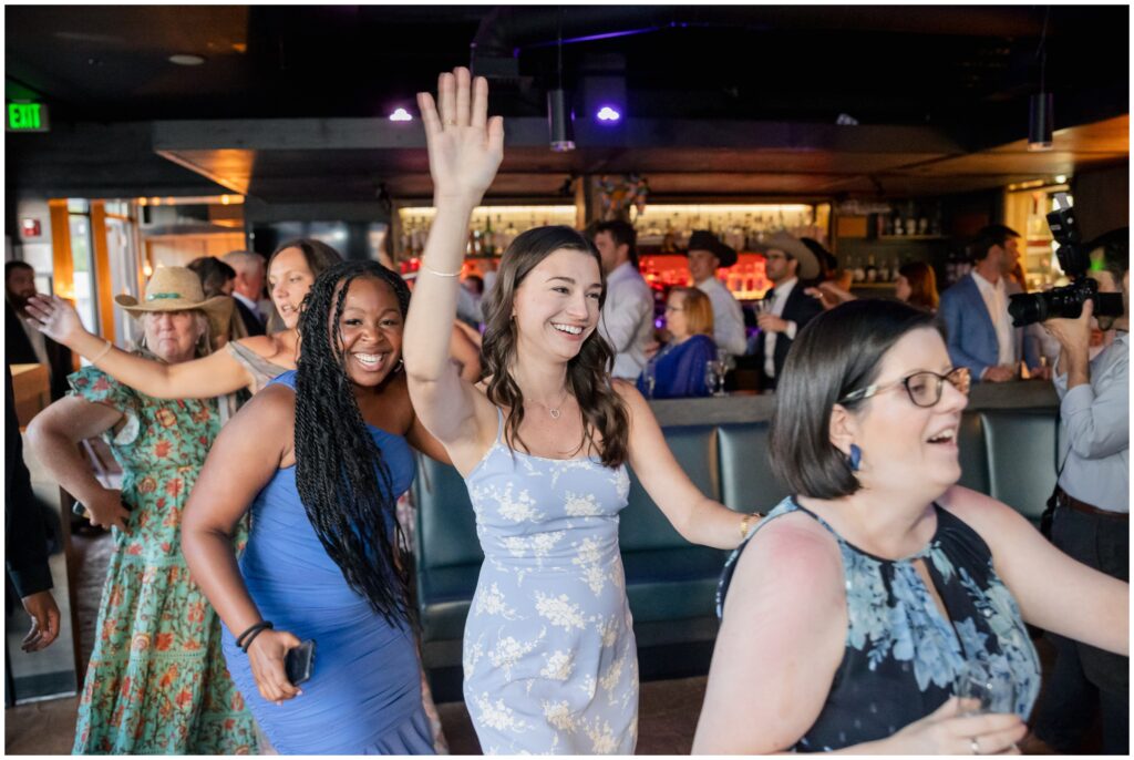 Line dancing during wedding reception at Table 79 in Steamboat Springs