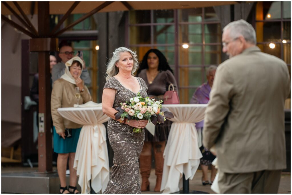 bride walking down with bouquet at ten mile station