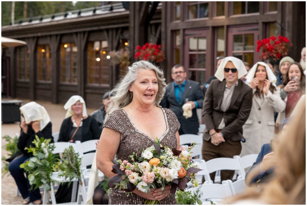 bride walking down isle with guests watching at ten mile station
