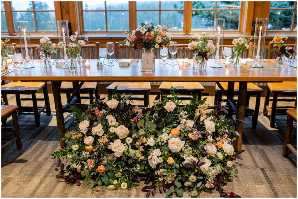 Floral decor in front of reception table designed by garden of eden