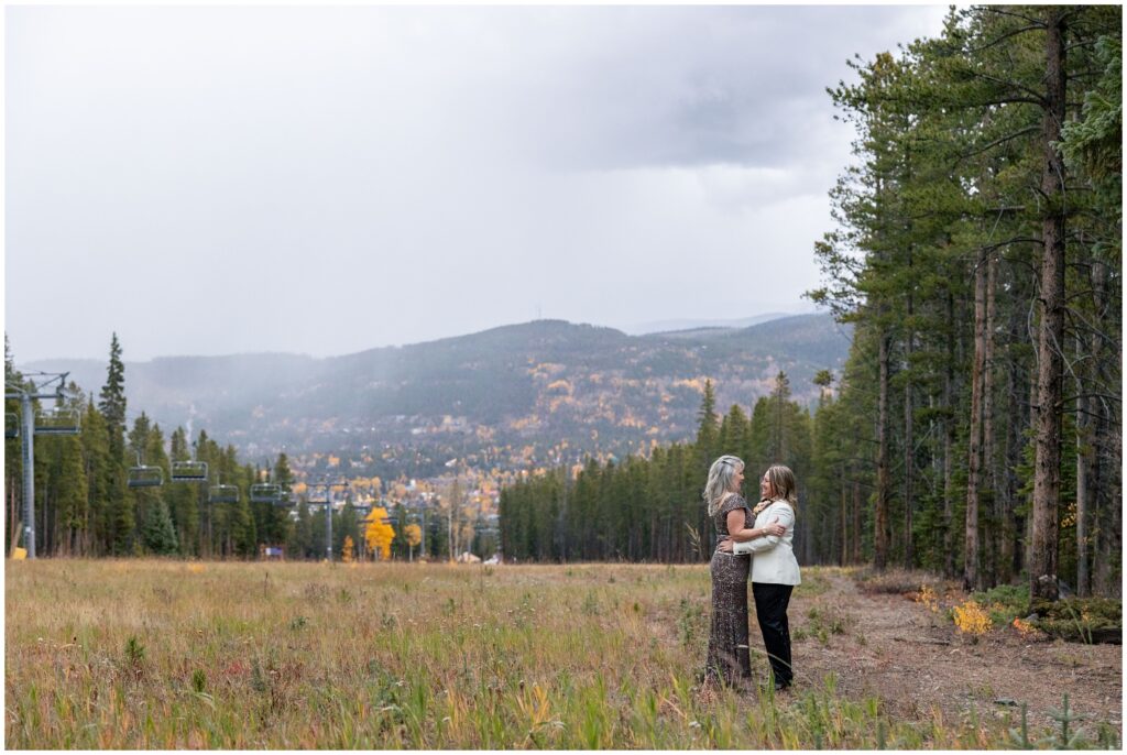 brides hugging at ten mile station