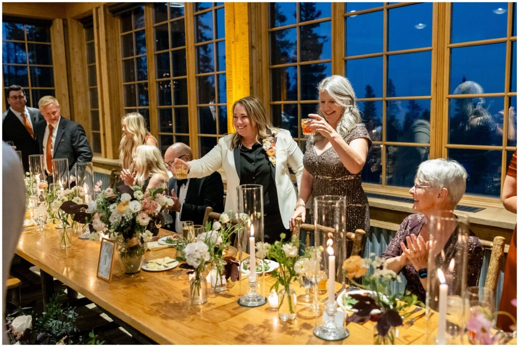 brides raising glasses at ten mile station