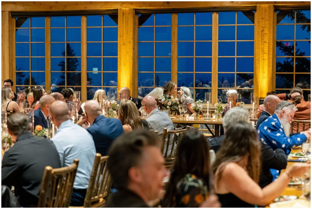 brides kissing during reception at ten mile station