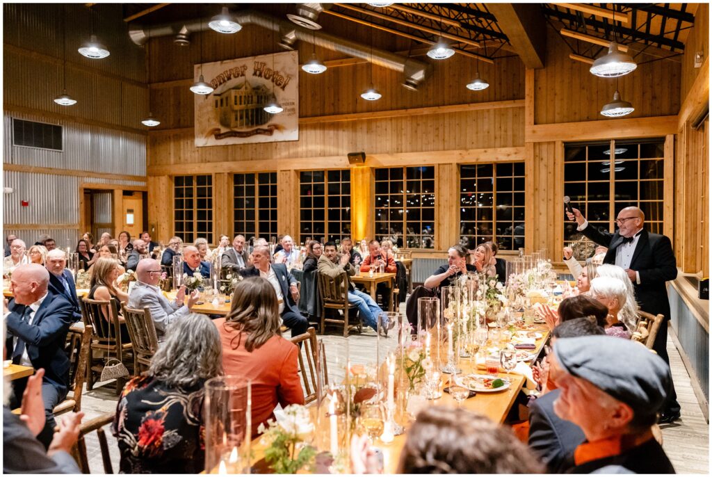 guests raising glasses during toast at ten mile station