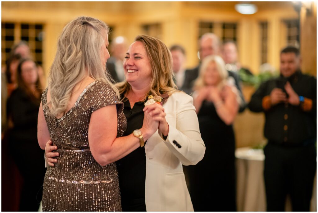 brides holding hands and dancing at ten mile station